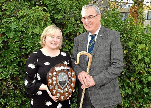 Press and Journal farming editor Gemma Mackenzie presents Pat Machray with his award