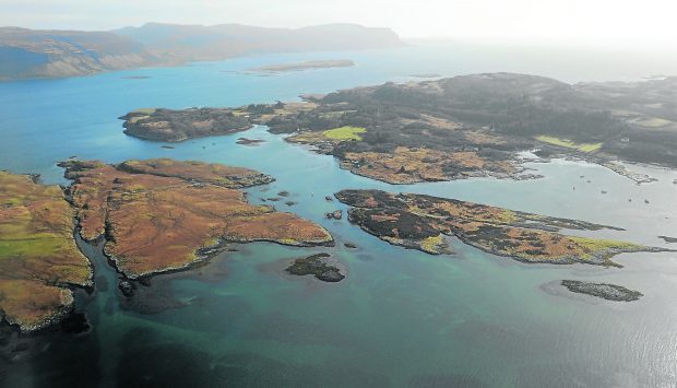 The island of Ulva, on the right, passed out of private ownership and into the hands of the local community.