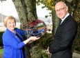 Gaelic Ambassador of the Year, Janet MacDonald of Tobermory, Mull with her award presented last night in Fort William. Also in the photograph is Deputy First Minister John Swinney. Picture by Sandy McCook