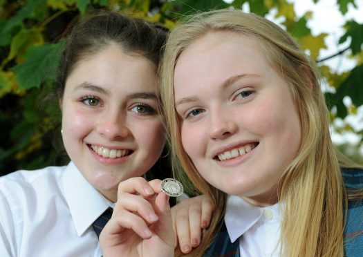 Alice Nic a'Mhaoilein of the Nicholson Institute, Stornoway (right), winner of the An Comunn Gaidhealach Silver medal for solo singing with runner up Peigi Barker (left) of Fortrose Academy. Picture by Sandy McCook.