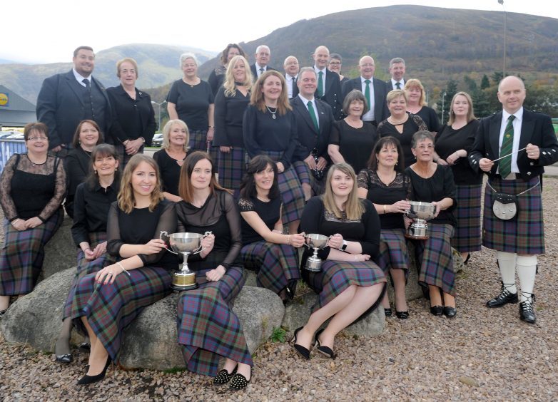 Lochs Gaelic Choir from Lewis with their conductor Ronnie Murray (right) and their trophies, The Anne MacKenzie Memorial Trophy, John Young Memorial Baton, Calum Robertson Memorial Trophy and the Evelyn Huckbody Memorial Trophy for the rural choirs.