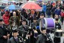 The Massed Choirs are led through Fort William by the Lochaber Pipe Band before performing on The Parade in the centre of the town. Pictures and video by Sandy McCook.