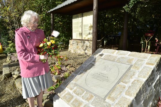 Colin Barron's niece, Daisy Ogg, beside the memorial.