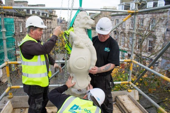 The lion is placed on top of the Muckle Cross.