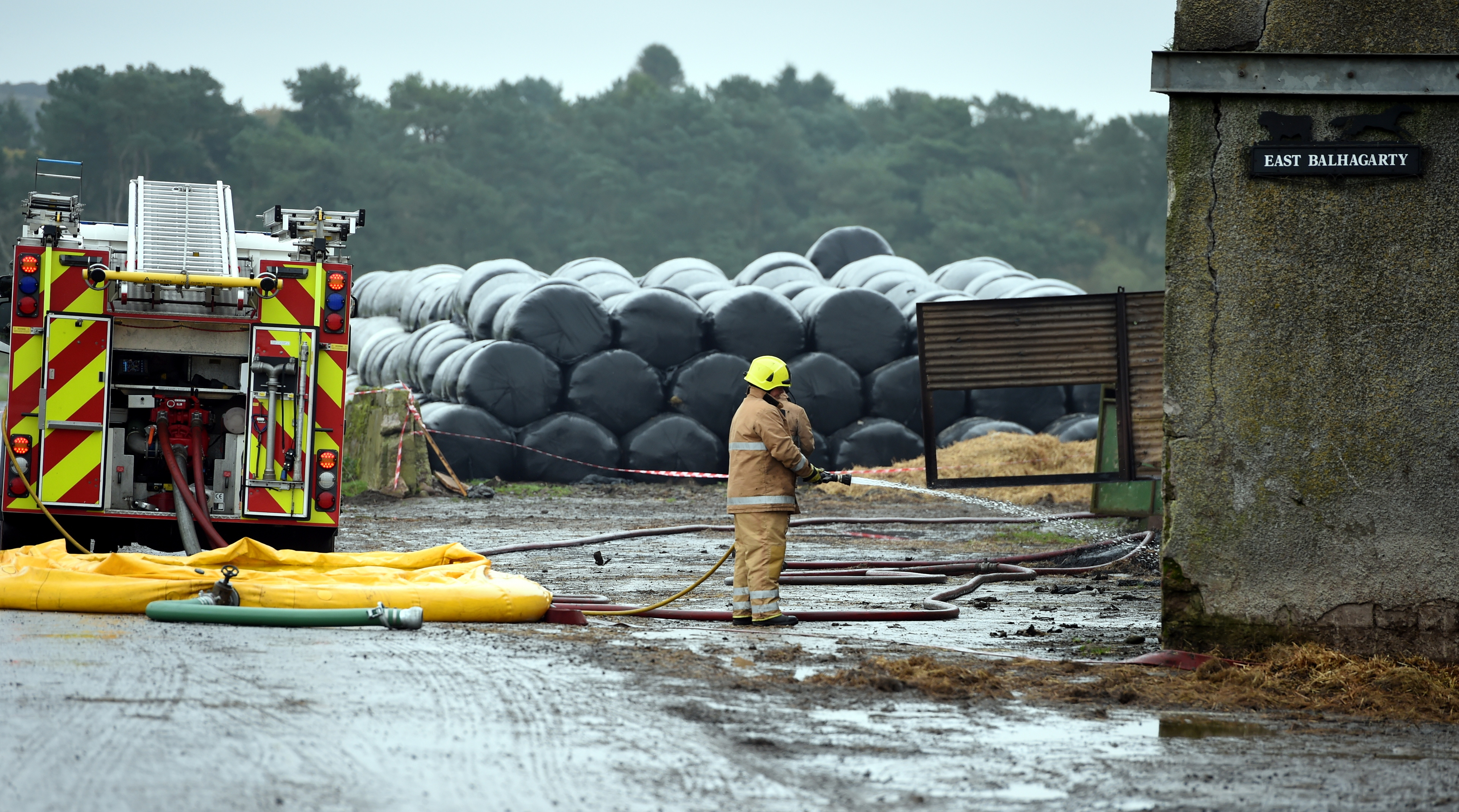 Fire fighters winding down at a barn fire at East Balhagarty Farm near St Cyrus. 
Picture by Jim Irvine
