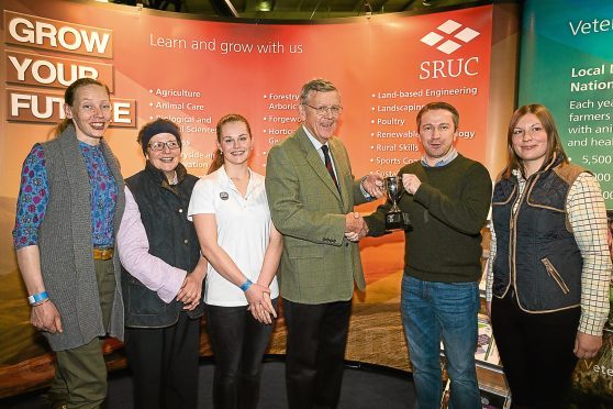 John Rhind, a Trustee of Mains of Loirston Trust, presents the 2017 Winter Wheat Challenge trophy to SRUC students, (left to right): Joanne Breese, Helen Parker, Emma Parvin, Timur Kharisov (team captain) and Heather Duff at AgriScot. The students are based at SRUC’s Aberdeen campus.