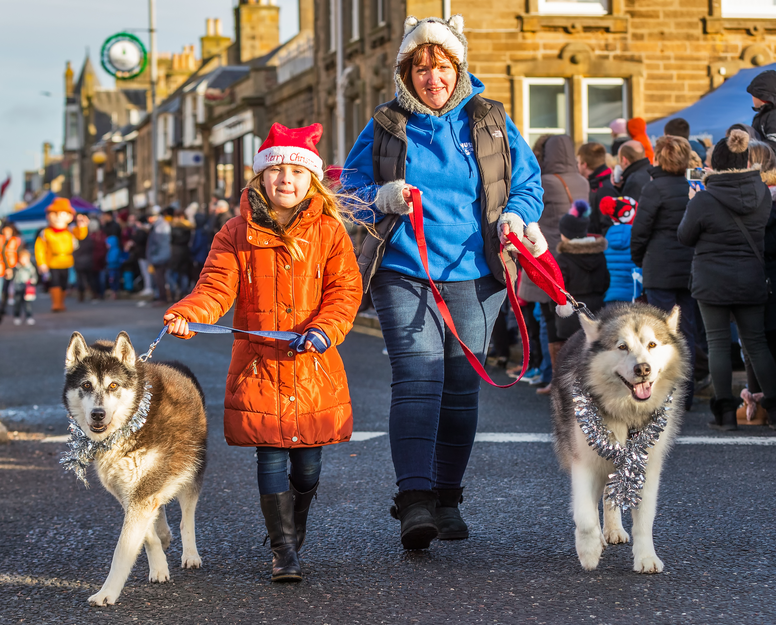 Lorna Simpson and Emmy Grant with their huskies in the Buckie Christmas Kracker parade.