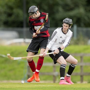 Daniel MacCuish, left, in action for Oban