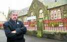 Councillor Craig Fraser outside Cromarty Primary School.