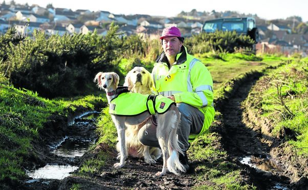 Derek Wood and his dogs dodged a bullet while on a walk near, Newtonhill. 
Picture by Jim Irvine