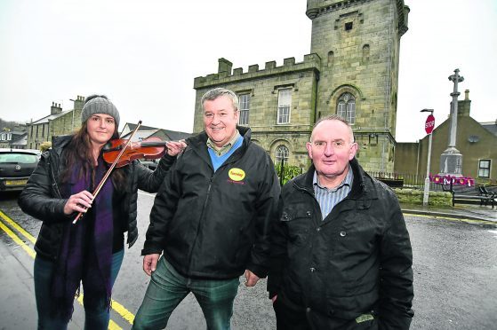 (L TO R) SARAH-JAYNE MORRICE FROM THE BUCHAN HERITAGE SOCIETY AND CHAIRMAN ROBERT CHAPMAN AND DIRECTOR HEBBIE FOWLIE FROM THE STRICHEN COMMUNITY PARK AT THE TOWN HALL.