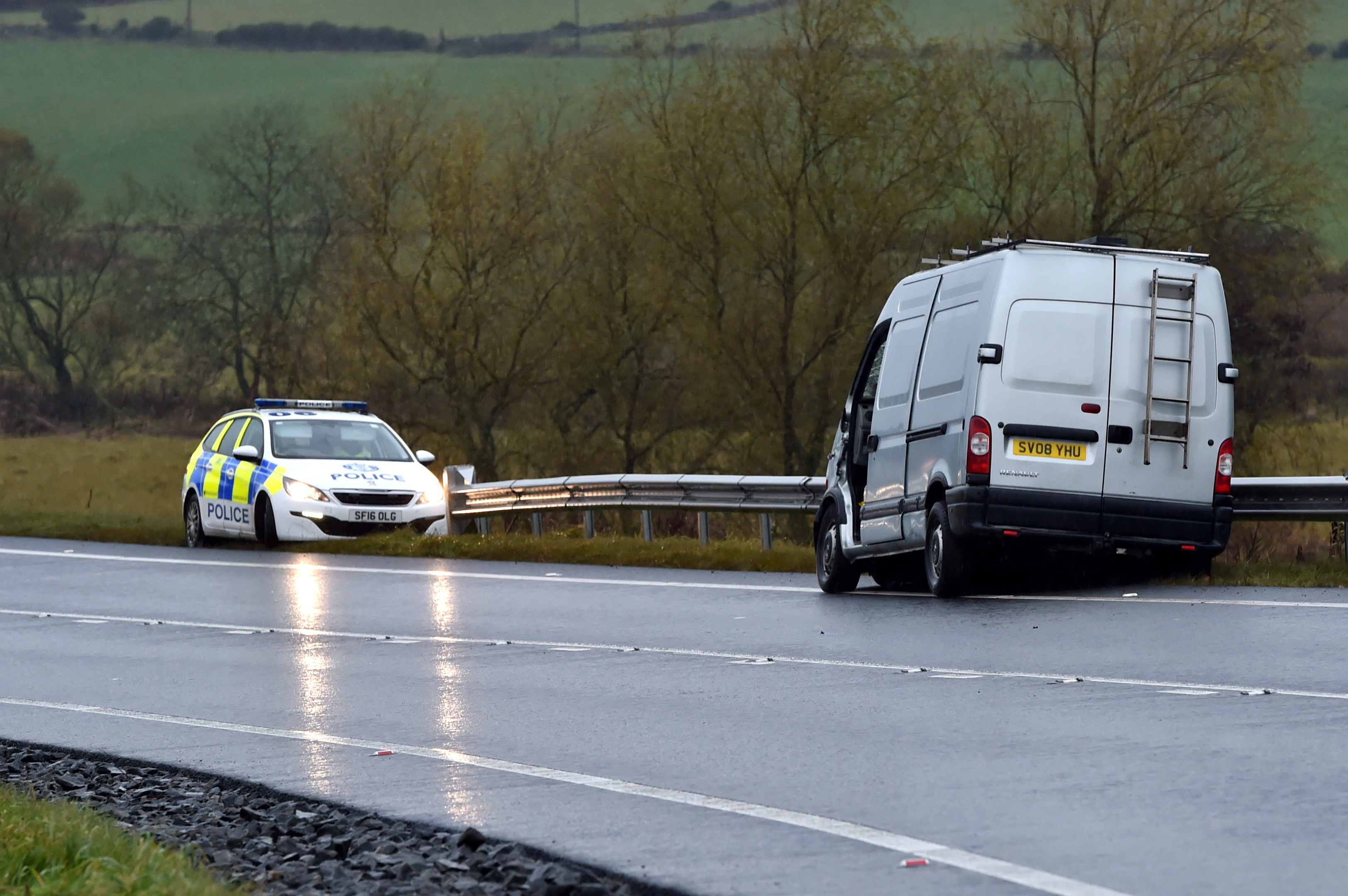 Police at the scene of the crash on the A96. Video and picture by Kenny Elrick.