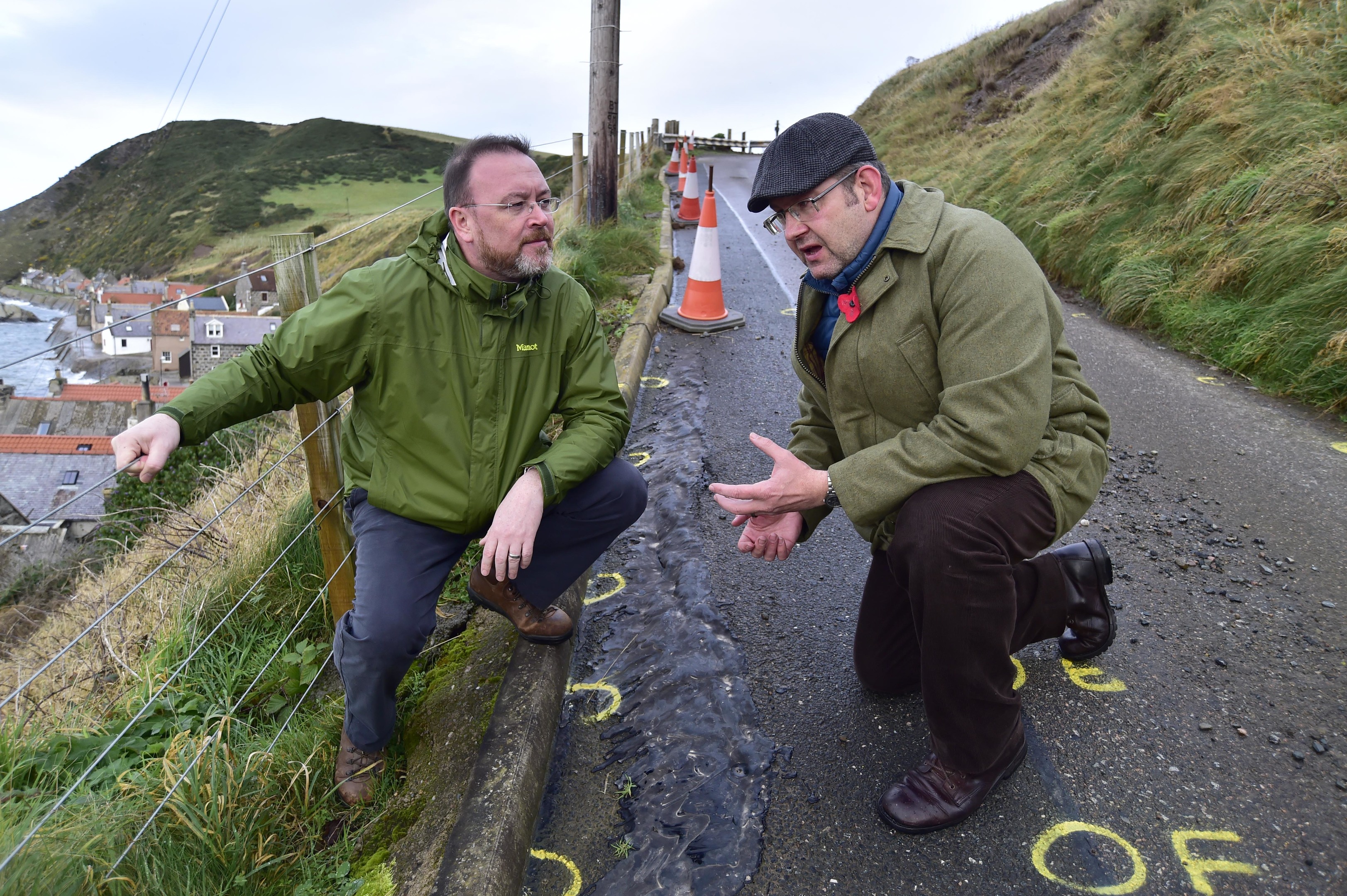 David Duguid MP and Mark Findlater inspect the damage.