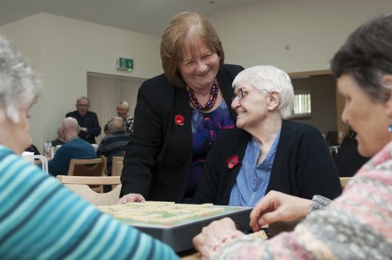 Mental Health Minister Maureen Watt, standing, visits the Harvest Centre in Elgin.