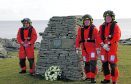 Paying respect at the cairn erected to mark the sad loss of winch man Bill Deacon are (l to r): Terri Mooney, Dave Ellis and Friedie Manson.