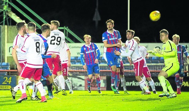Inverness' Brad McKay (second from left) scores from a header to make it 1-0