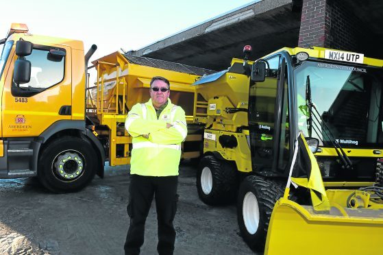 Gordon Walter with the gritter. 
Picture by Jim Irvine