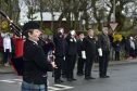 Pipe Major Denise Buchan plays at the Fraserburgh remembrance service.