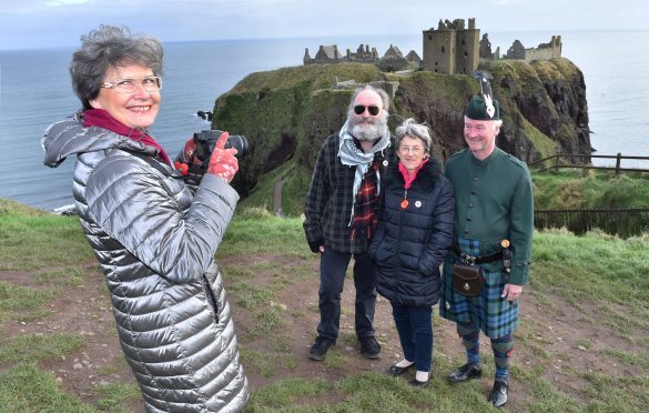 Veronique Forensi, Deputy Mayor of Acheres, takes a picture of (from left) Phil Mills Bishop,  Sue Ajouman, President of Acheres Twinning Committee and Richard Holman-Baird, owner of Rickarton Estate.
Picture by Colin Rennie.