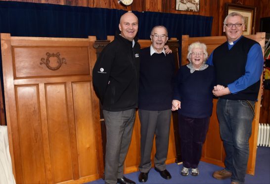 Ballater retired joiner Ian Hepburn (second left) pictured with (from left) North Contracts director Lee Garden, Ian's wife Sheena and Rev David Barr (Picture: Colin Rennie)