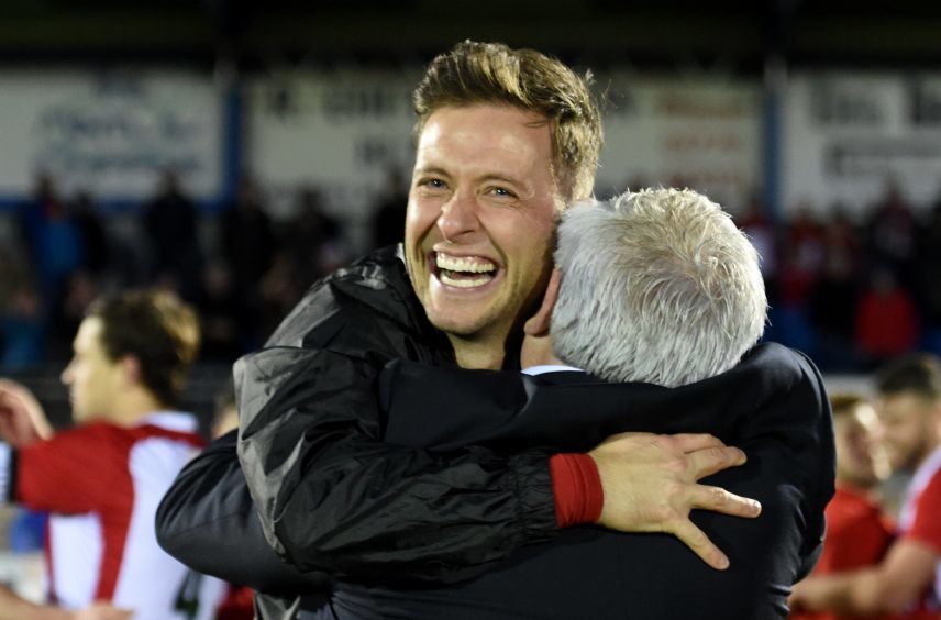 Formartine manager, Paul Lawson celebrates the cup win.