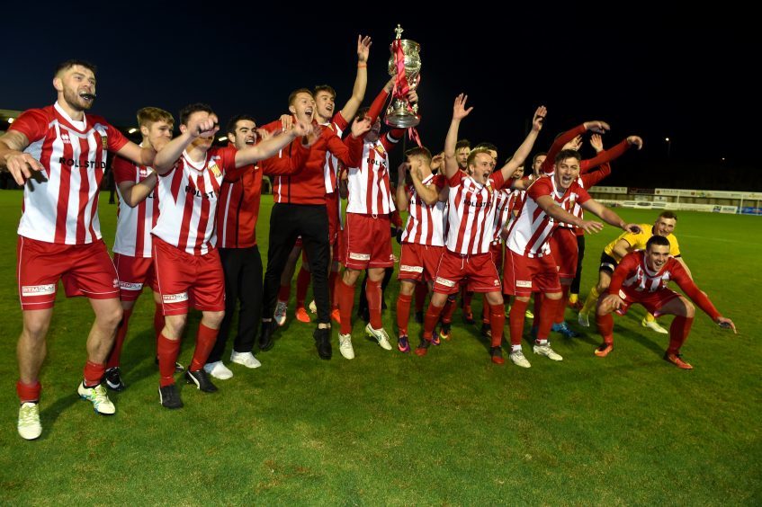 Formartine celebrate with the cup.