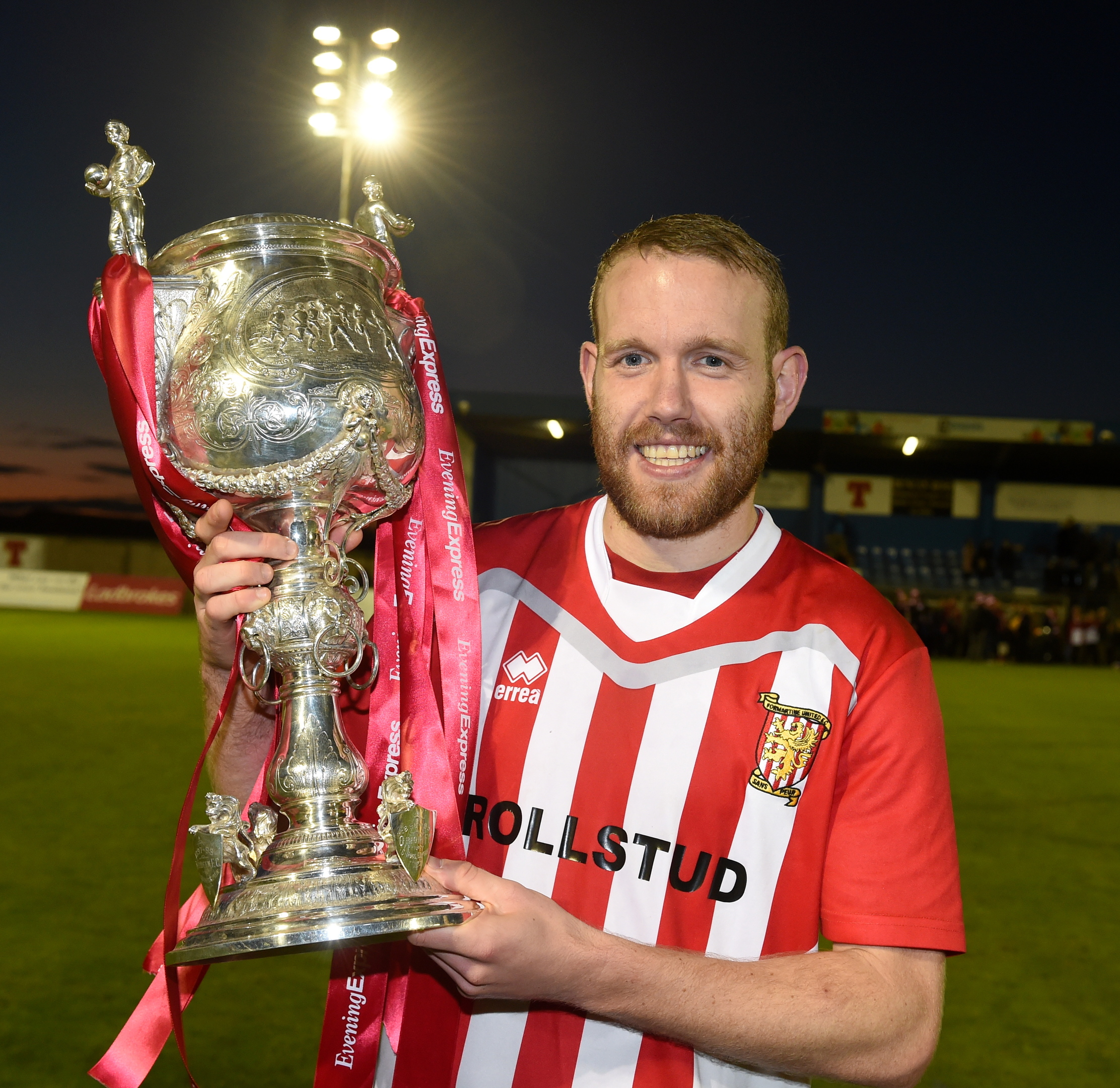 Goal scorer, Garry Wood with the cup.