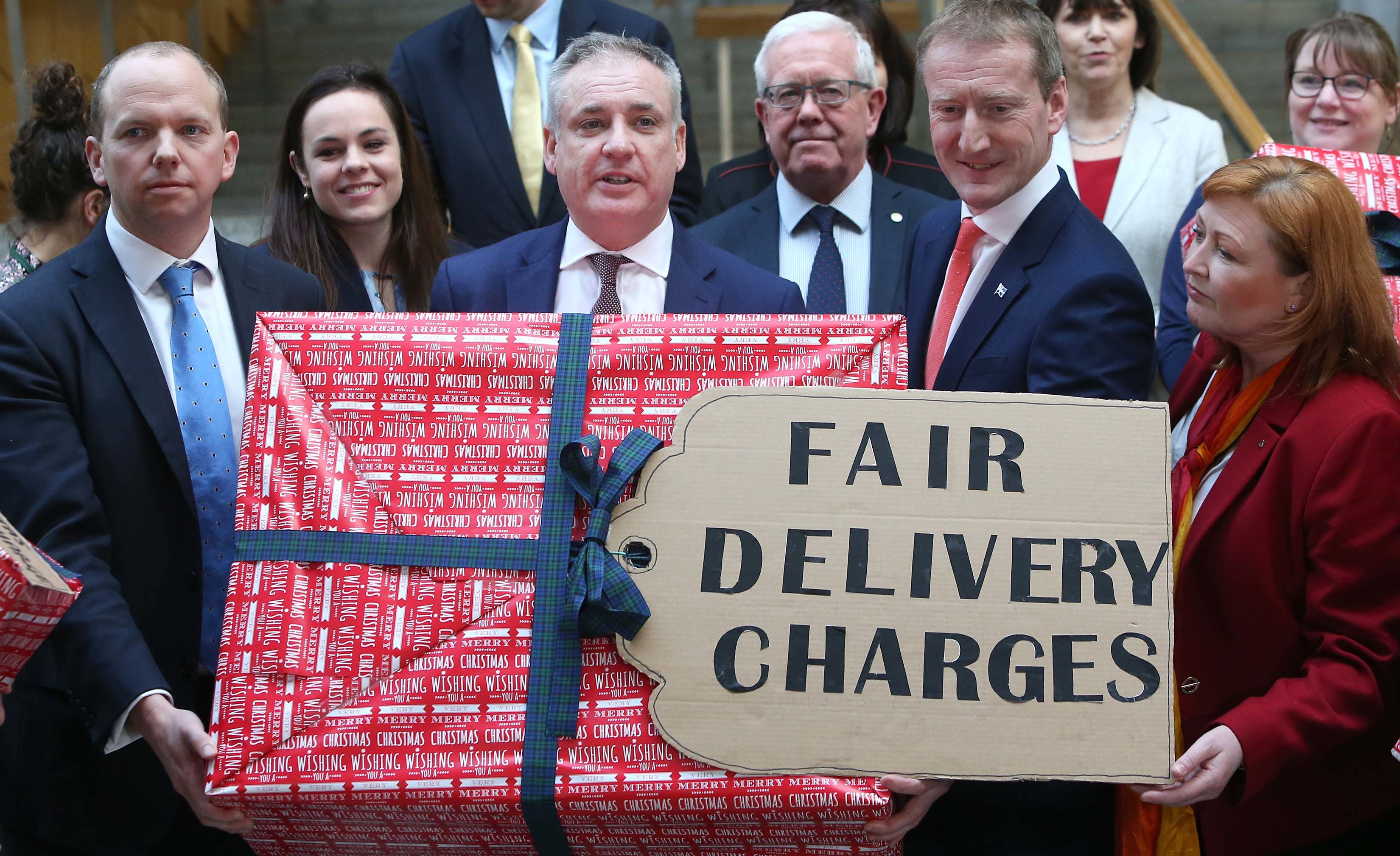 The campaign for fair delivery charges received cross-party support in the Scottish Parliament.