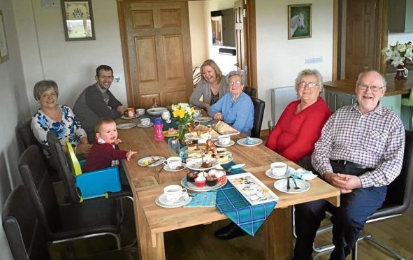 The Irvine family hosting a tea party for Contact the Elderly