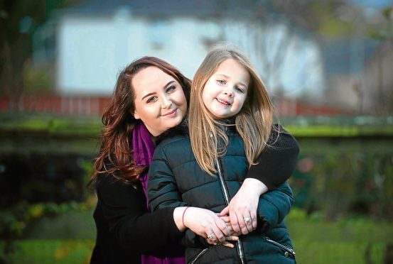 Poppy with mum Sarah.