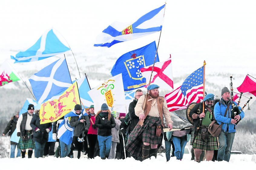 Protestors marched from Culloden Battlefield to the site of the controversial proposed housing development.