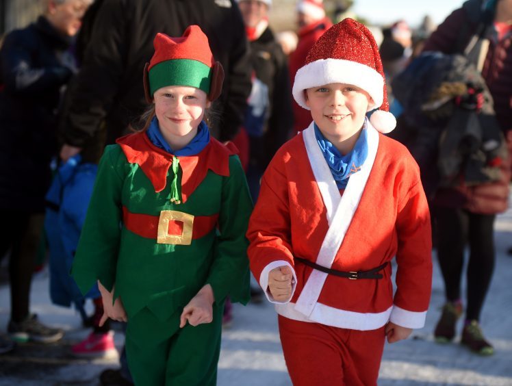 Inverurie Elf and Santa Run. Pictured from left, Isla, 6 and Fraser Chalmers, 8. Picture by Heather Fowlie.