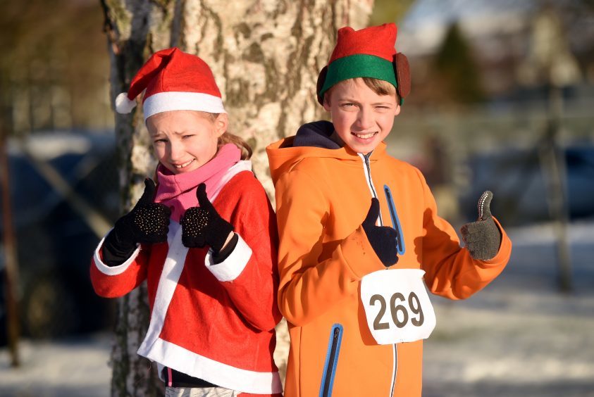 Inverurie Elf and Santa Run.  Pictured from left, Rhona Bomphrey, 10 and Aaron Cardno, 11. (Winners of the race). Picture by Heather Fowlie.