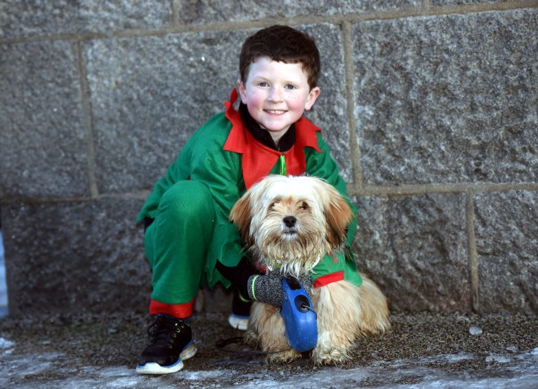 Inverurie Elf and Santa Run. Pictured is Max Kelly, 7 and his dog Flapjack. Picture by Heather Fowlie.