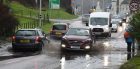Traffic carefully makes its way through flooding on Fort William’s North Road