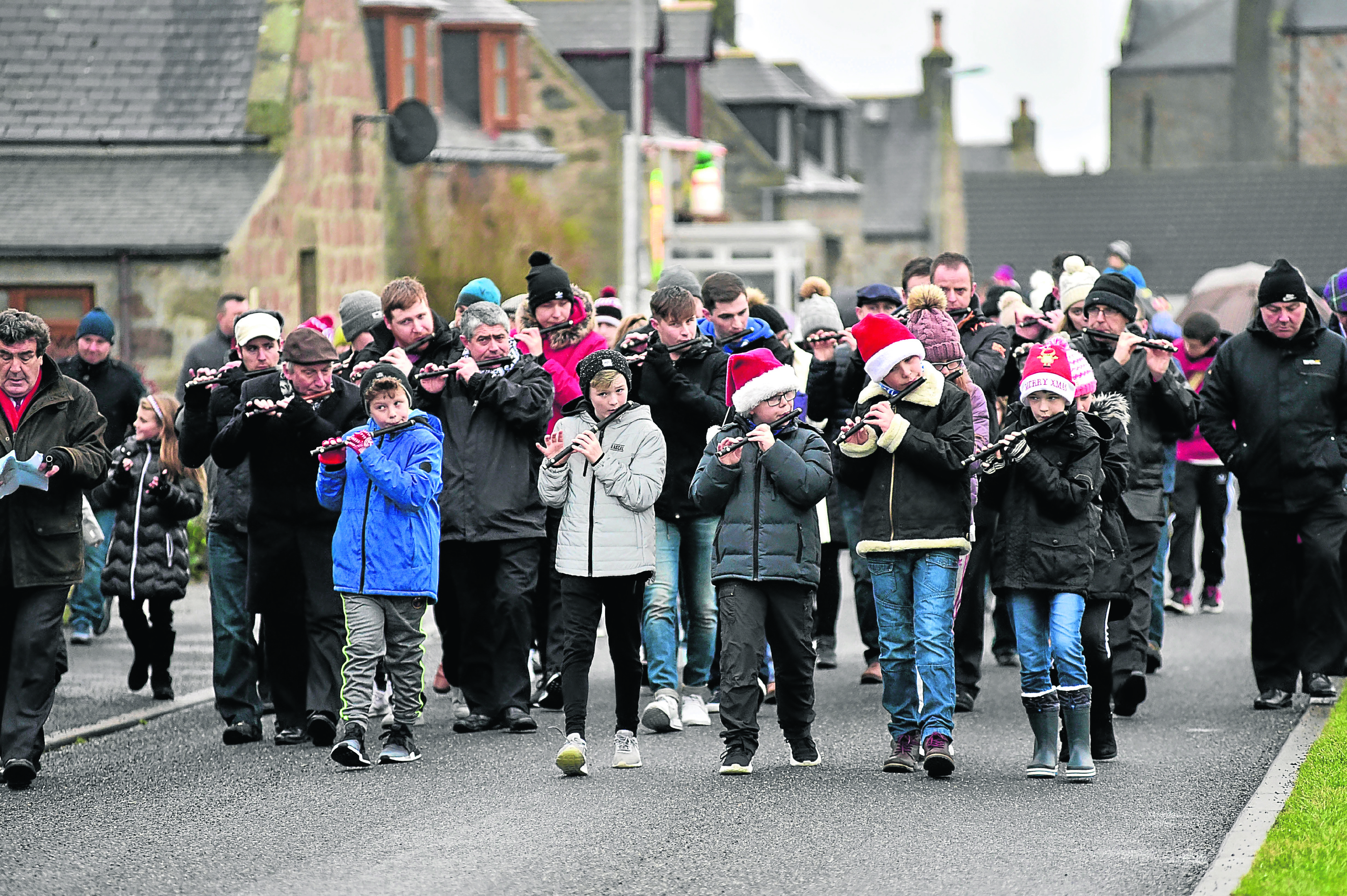 The flute band leads the annual Christmas Day walk