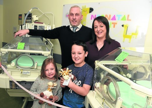 Pictured from left, Graham Wood, wife Gillian Wood and their children, Jack, 8 and Ellie, 7.