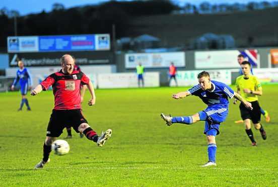 Cove's Mitch Megginson scoring the second goal of the game.
Pictures by Darrell Benns