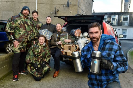 Ian Garden donated 100 blankets and thermal flasks to Social bite and the Cyrenians so they can distribute them to Aberdeens homeless community.
Picture of (L-R) Michael Byrne, Laim Byrne, Natasha Watt, Matthew Thomas, Mike Burns (Cyrenians) and Ian Garden.

Picture by KENNY ELRICK     07/12/2017