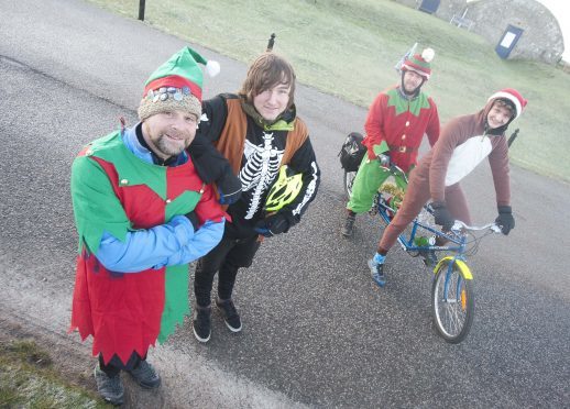 Outfit Moray ran a tandem around the new NE250 route to raise money to stop the charity folding.  Pictured: Stewart Evans, Wayne Reid , Chris McCann and David Brackpool. 





Photo by
Michael Traill