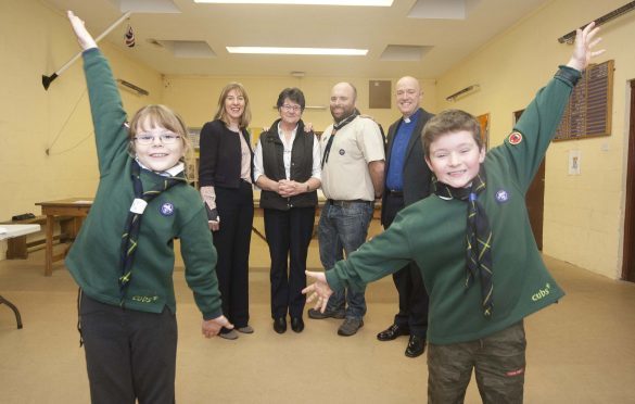 In photo from the left, Linda Brown head teacher at lossiemouth High school,  Eliz Munro,  Allan Anderson group scout leader and  Rev Geoff  Mckee minister of St Gerardines High .
Also in the photo at the front Emily Rose findlay 8 and Jamie Read 8