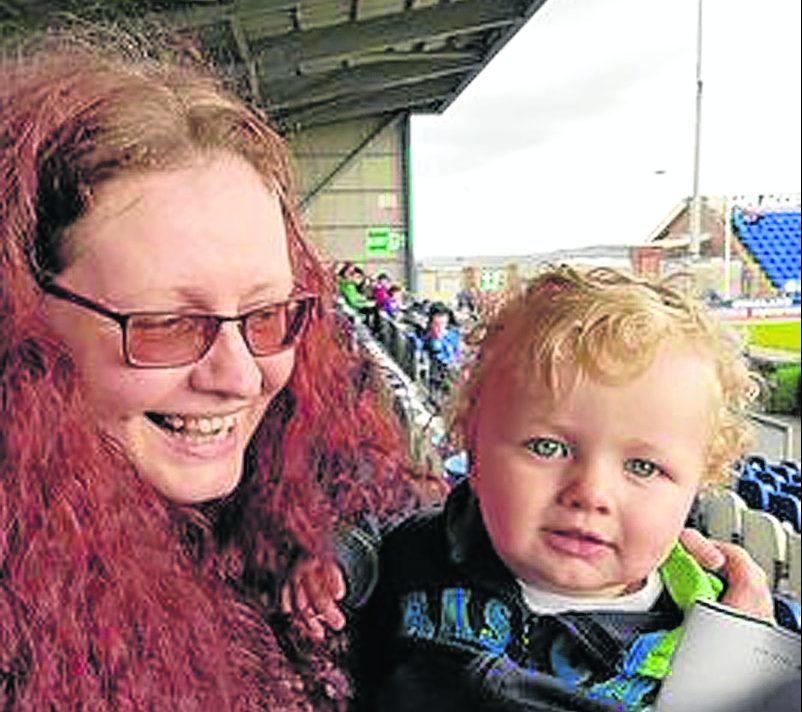 Liz MacRae with her grandson James Anderson watching Inverness Caledonian Thistle