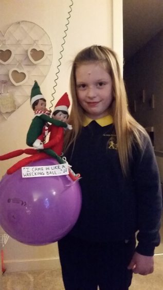 The Elves (Jingle Belle and Stripes) are re-creating a scene from Lily's favourite song "Wrecking Ball" by Miley Cyrus.

FROM: Lily Miller.....Age 7 from Alves, Moray.