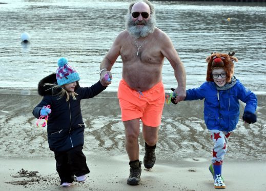 Phil Mills Bishop is with Isla Wilson, 7 and Kai Cox, 7. Picture by Colin Rennie.