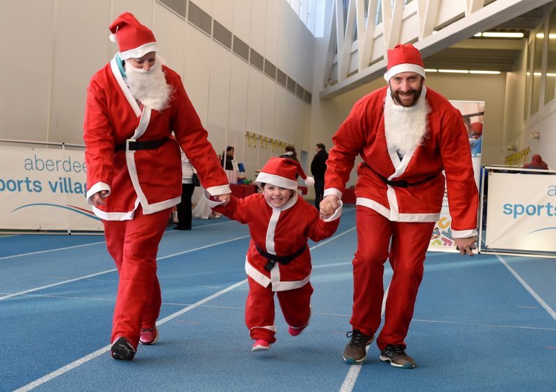 Aberdeen Santa Run: In the picture are Victoraia Forrest, Ethne Forrest and John Forrest. 
Picture by Jim Irvine