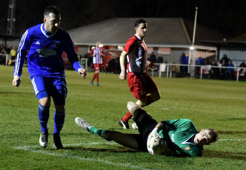 Connor Scully is beaten by the keeper, Ewen MacDonald.