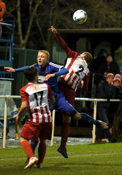 Harry Milne takes on the defence.