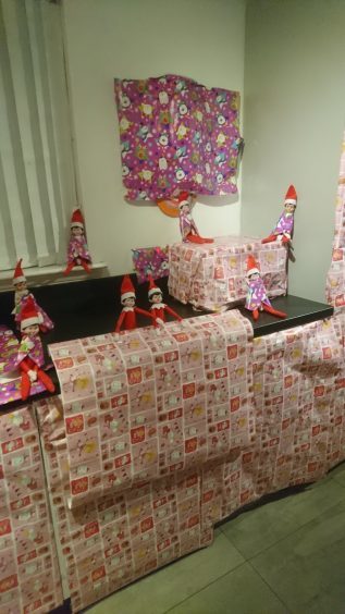 These elves have been having some fun with wrapping paper at the Phillips family home.