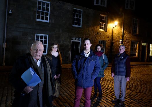 Professor Claude Wischik (left) is pictured with Gordon Mutch, chair of Old Aberdeen Community Council (right) and students (from left) Maja Skretowska, Jacub Cudak and Maria Manicone. Photograph by Colin Rennie