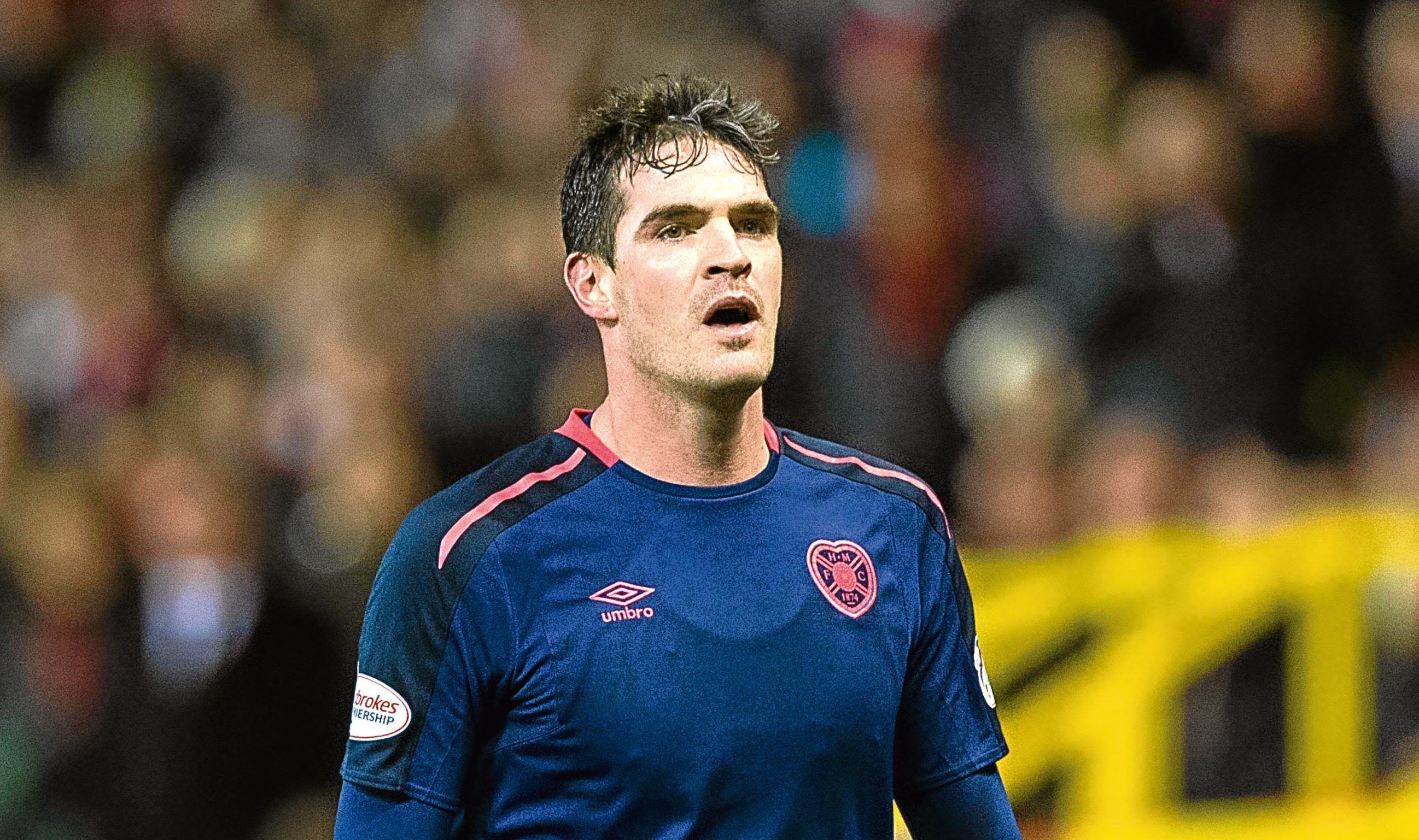 Hearts' Kyle Lafferty is dejected after he is sent off by referee John Beaton